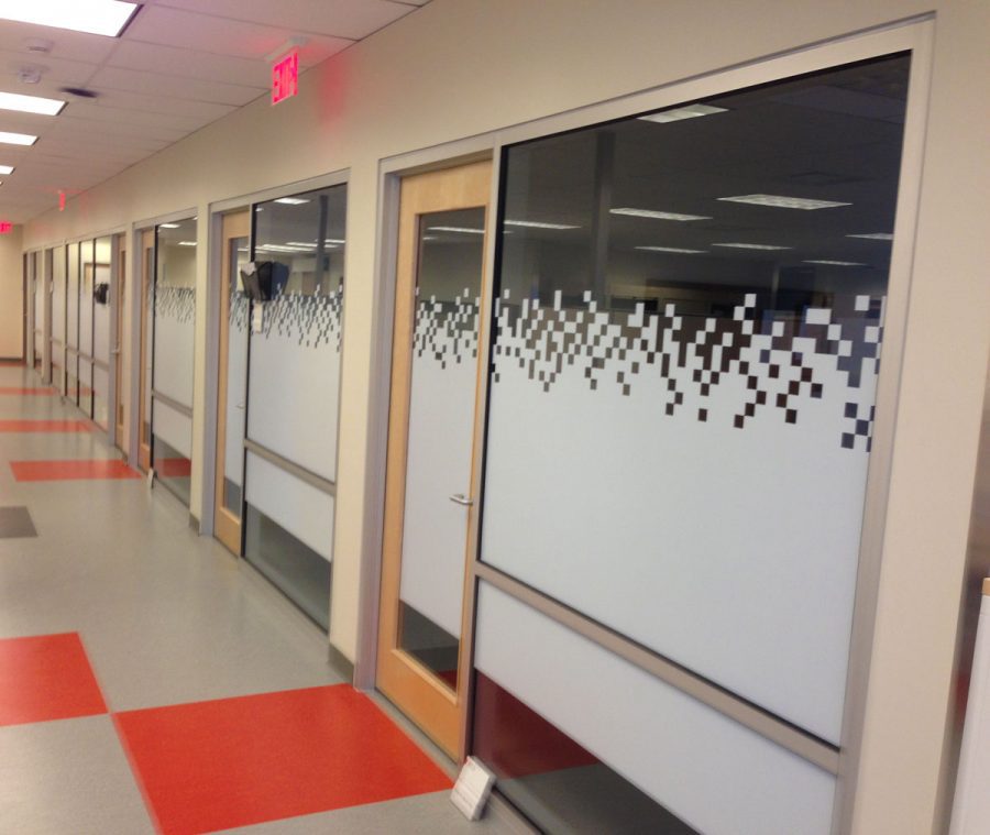 Decorative window films covering office windows.