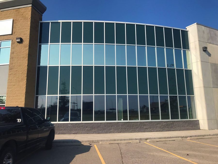 Security window film applied to lower and upper windows.